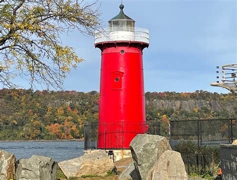 red house lighthouse with metal bridge|little red lighthouse.